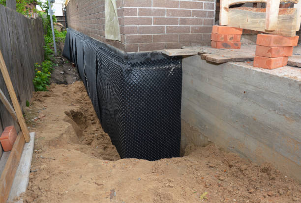 SJ Waterproofing Pros technician performing targeted Waterproofing assessment in Lakewood, NJ